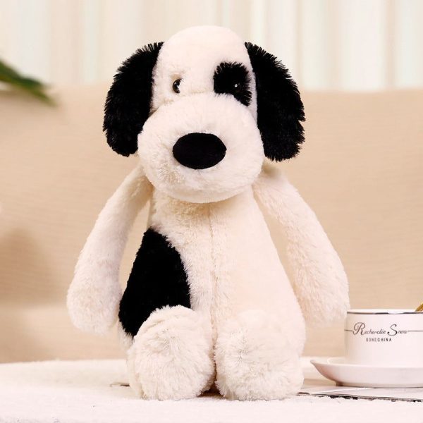 peluche chien blanc avec un oeil noir