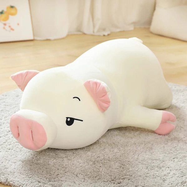 peluche cochon allongé endormi