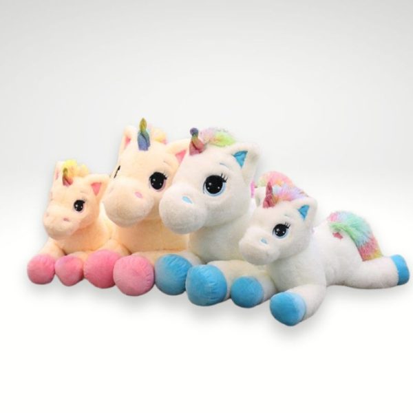 peluche licorne avec des étoiles dans les yeux