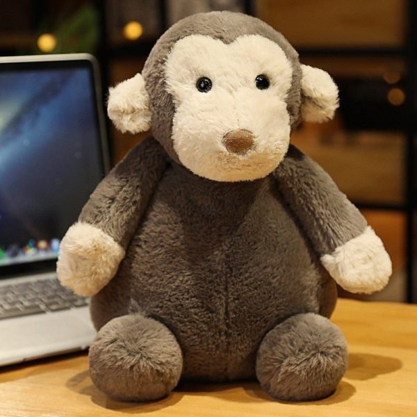 peluche singe bébé assis